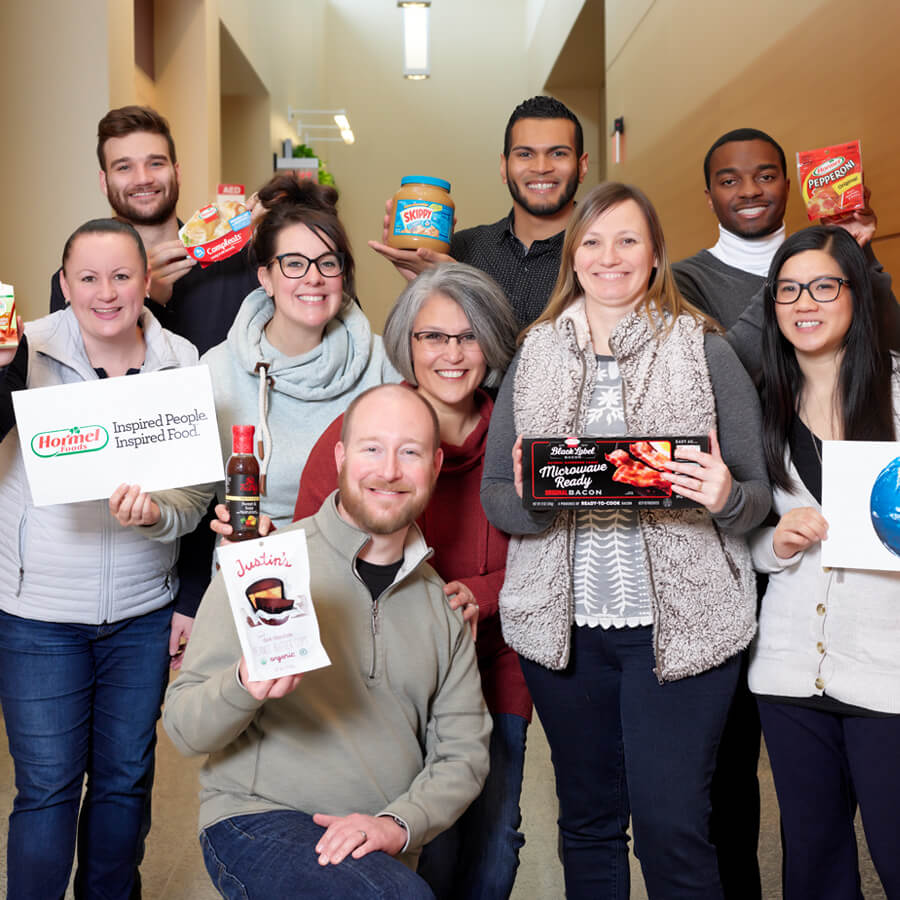 168官方澳洲幸运5结果体彩 hormel foods employees holding a diverse set of products